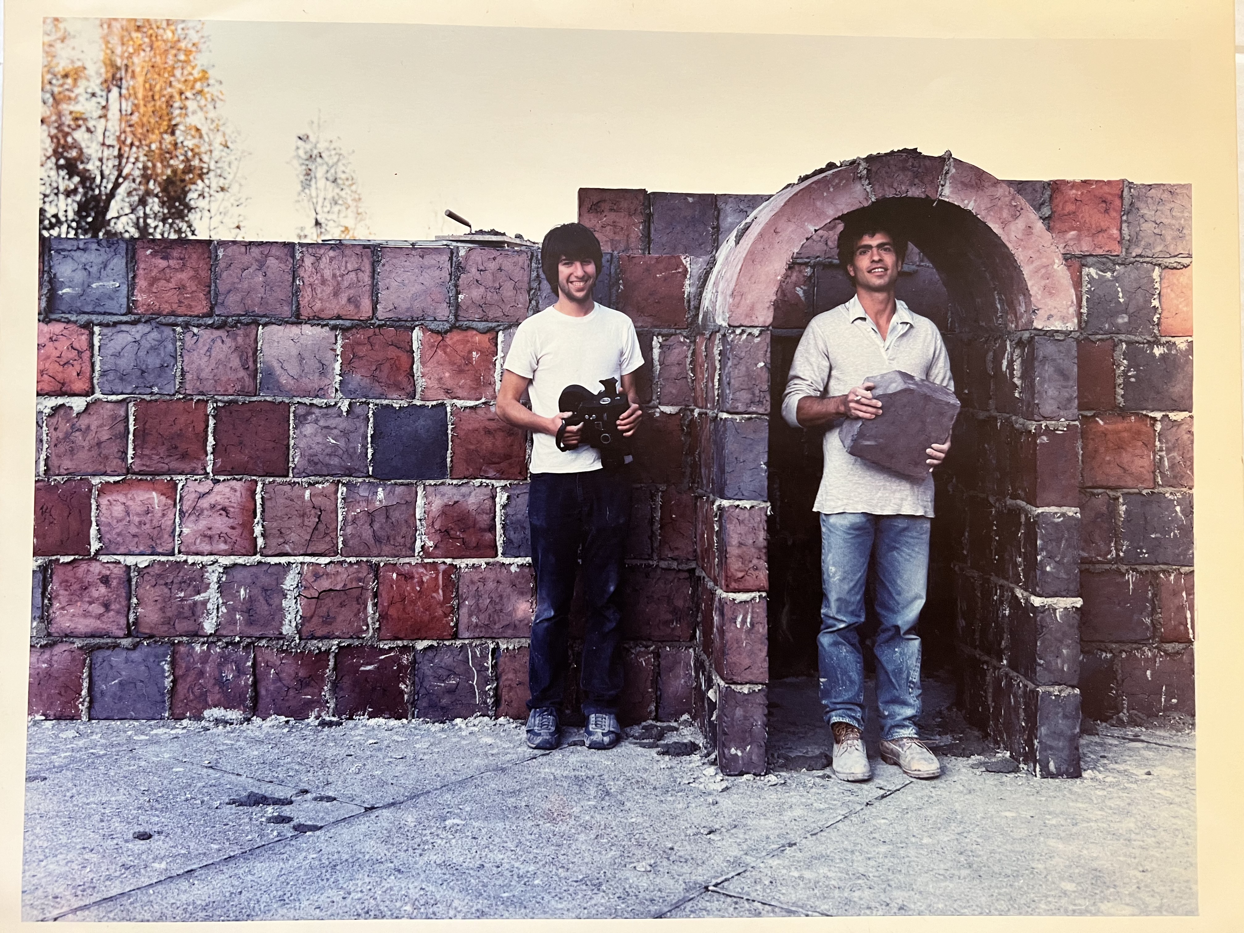Buddy and friend with brick archway installation